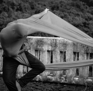 A person in a flowing, graceful stretch.