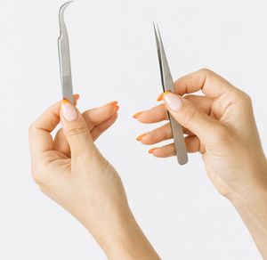 Close up on hands in a precise position.